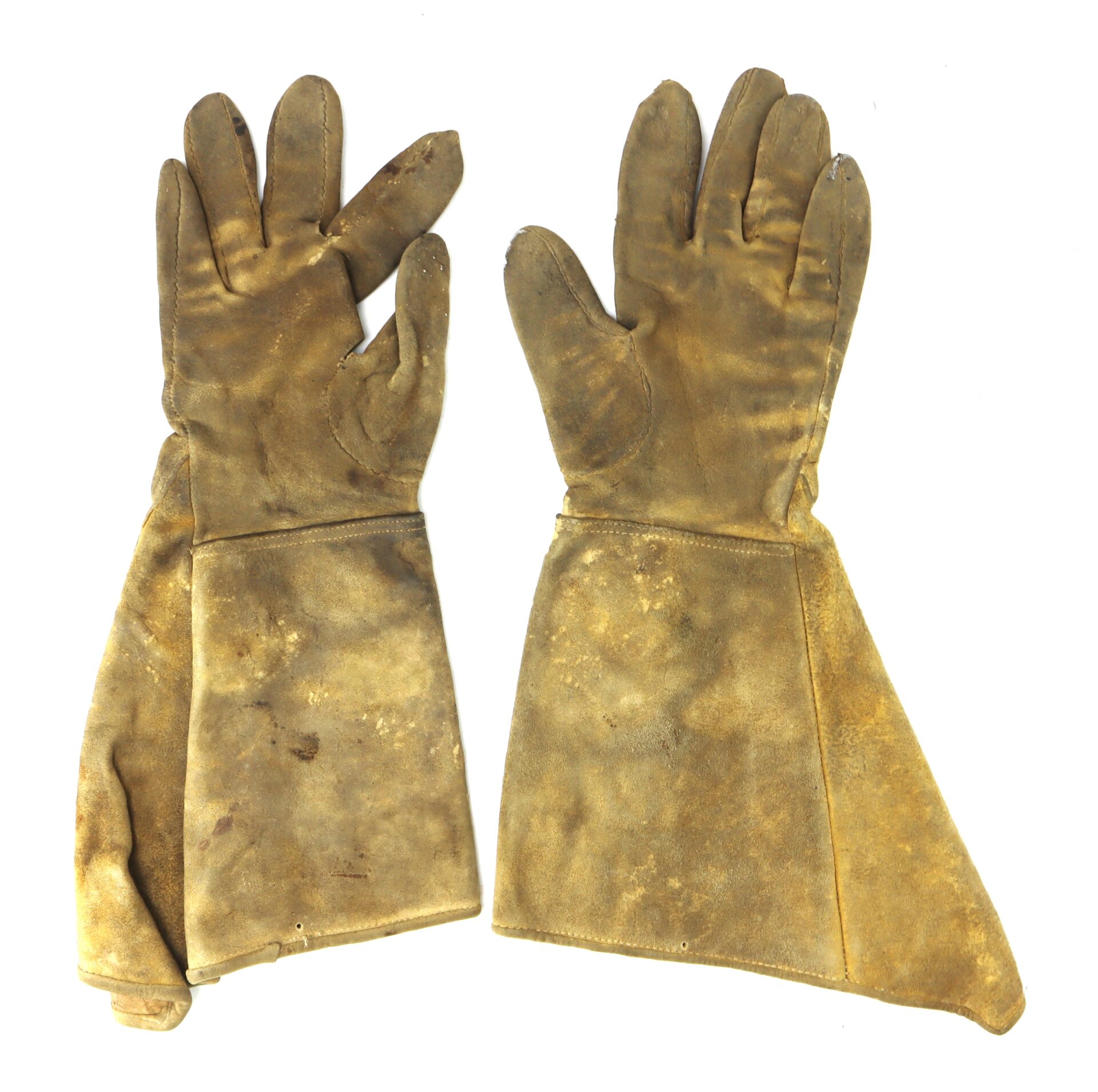 A pair of worn, stained, brown leather gloves with long cuffs, laid flat on a white background.