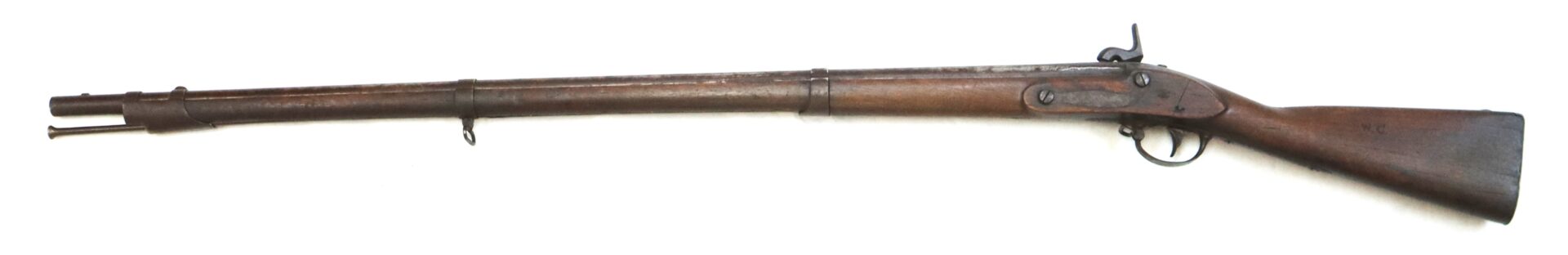 A vintage wooden-stock musket with a metal barrel and trigger mechanism, shown in a side view against a white background.