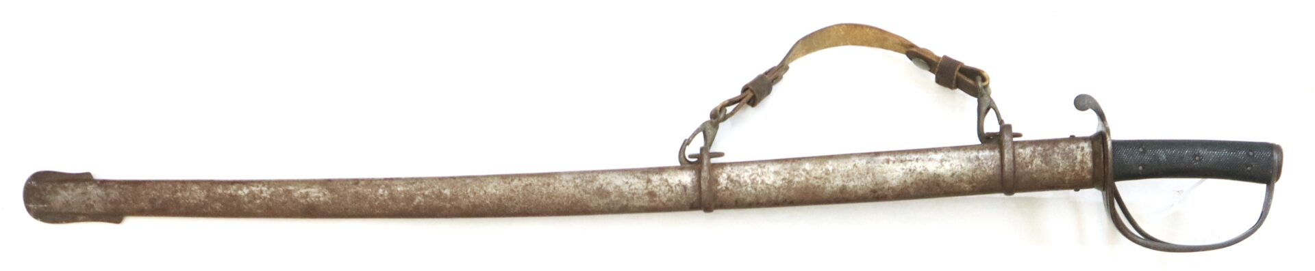 A rusted metal sword in a scabbard with a leather shoulder strap and a black handle with a hand guard.