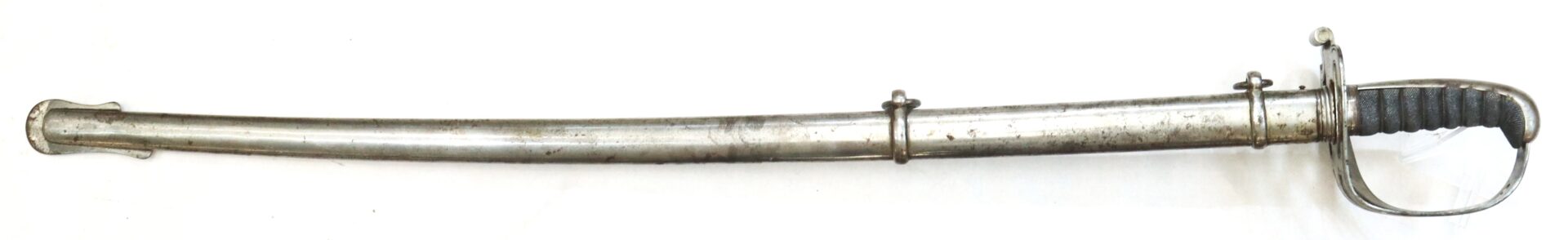 A metal cavalry saber with a curved blade, black grip, and protective hand guard, sheathed in a metallic scabbard with two hanging rings.