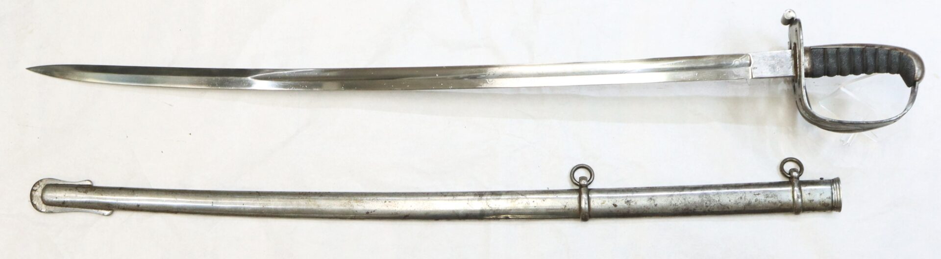 A steel sword with a curved blade and a protective hand guard, displayed above its matching metal scabbard on a plain background.