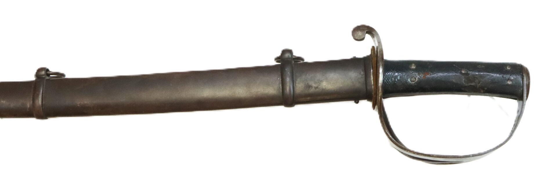A close-up of an antique sword with a black grip, metal guard, and partially visible sheath against a white background.