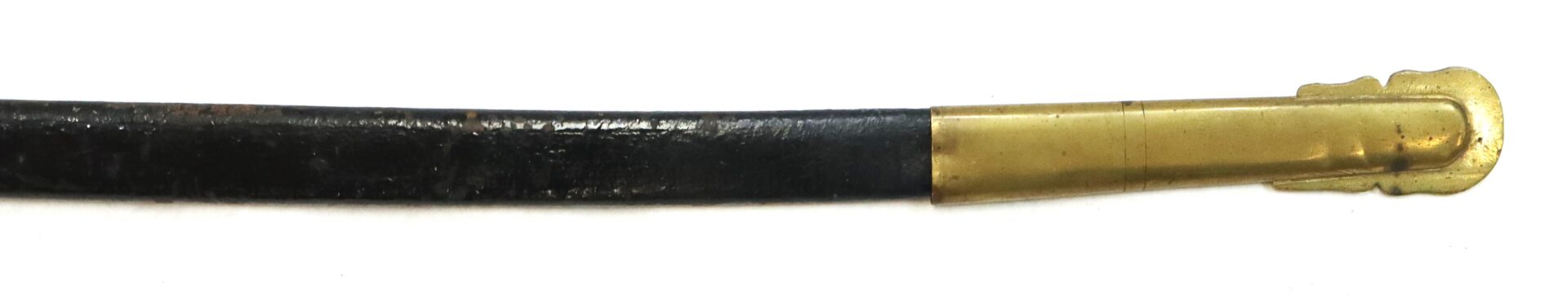 Close-up of a black leather scabbard with a brass tip, shown against a white background.