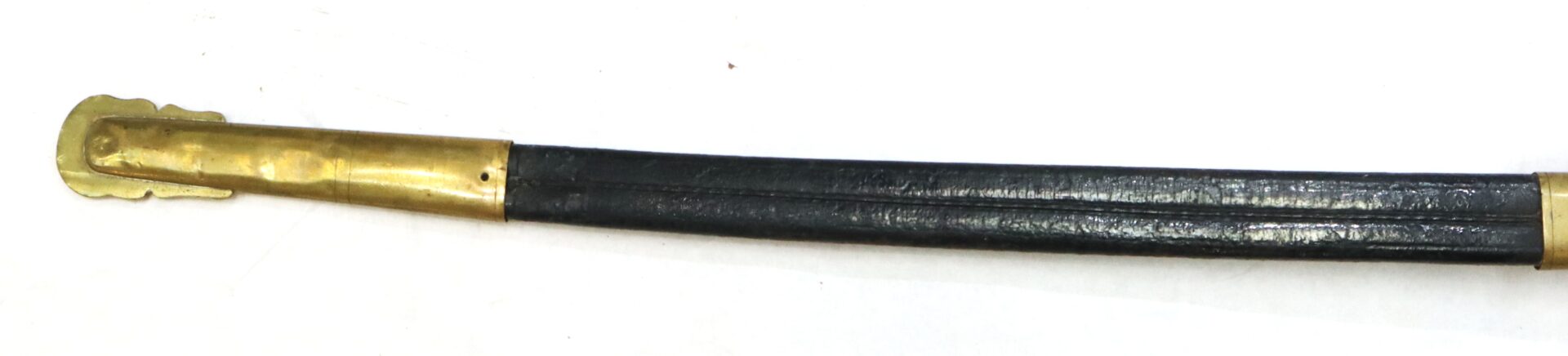 A black leather scabbard with a brass tip, viewed on a white background.