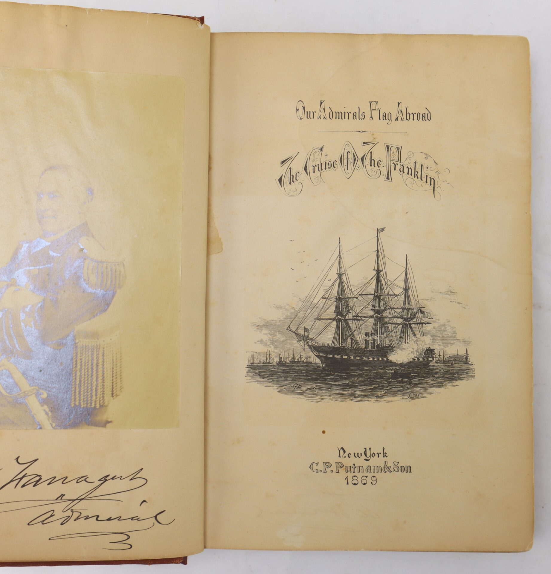 Open book showing a faded photo of a man in uniform on the left and a title page on the right, featuring an illustration of a ship and text about "The Cruise Of The Franklin," dated 1869.