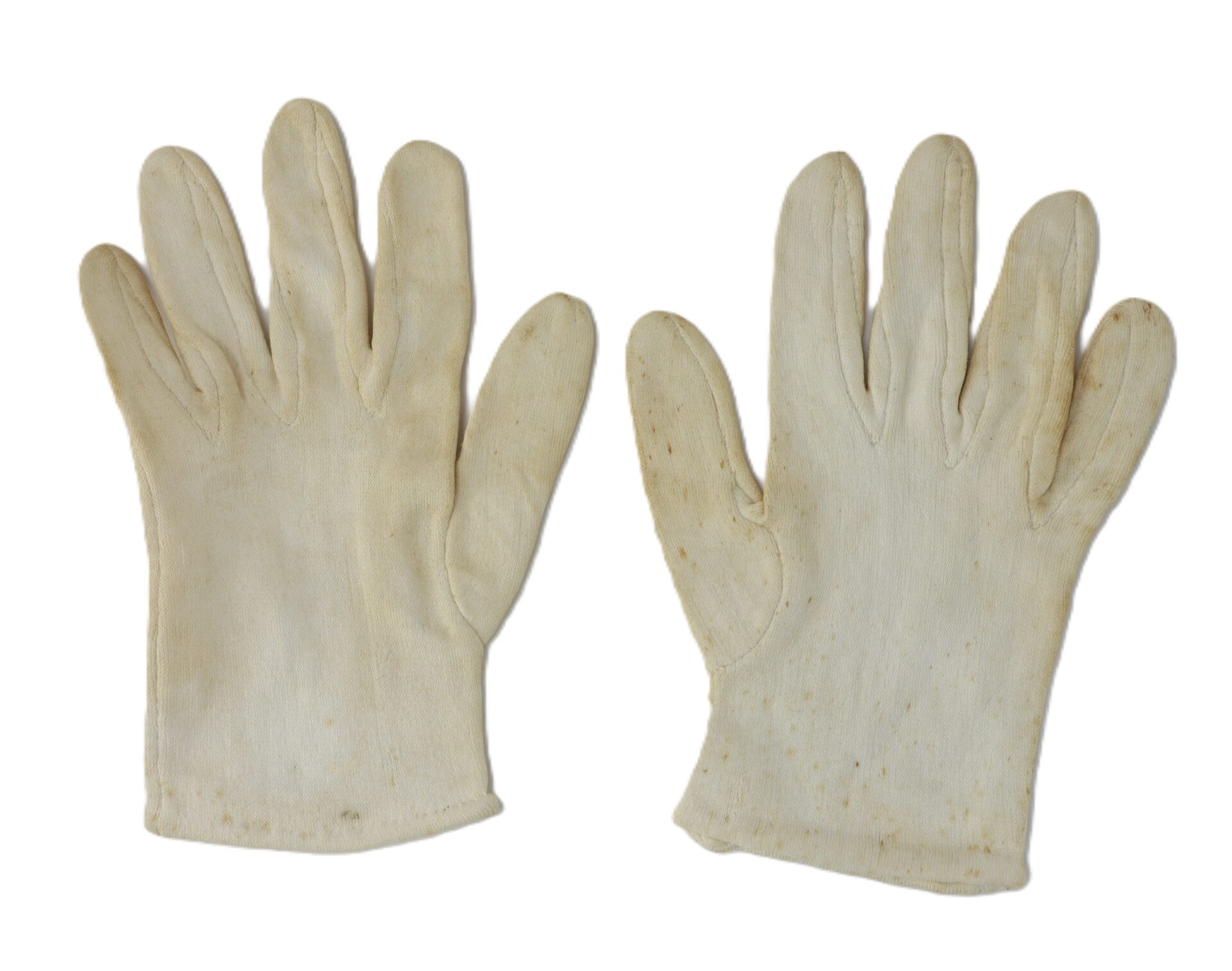 A pair of off-white fabric gloves with slight discoloration and minor stains, laid flat on a white background.