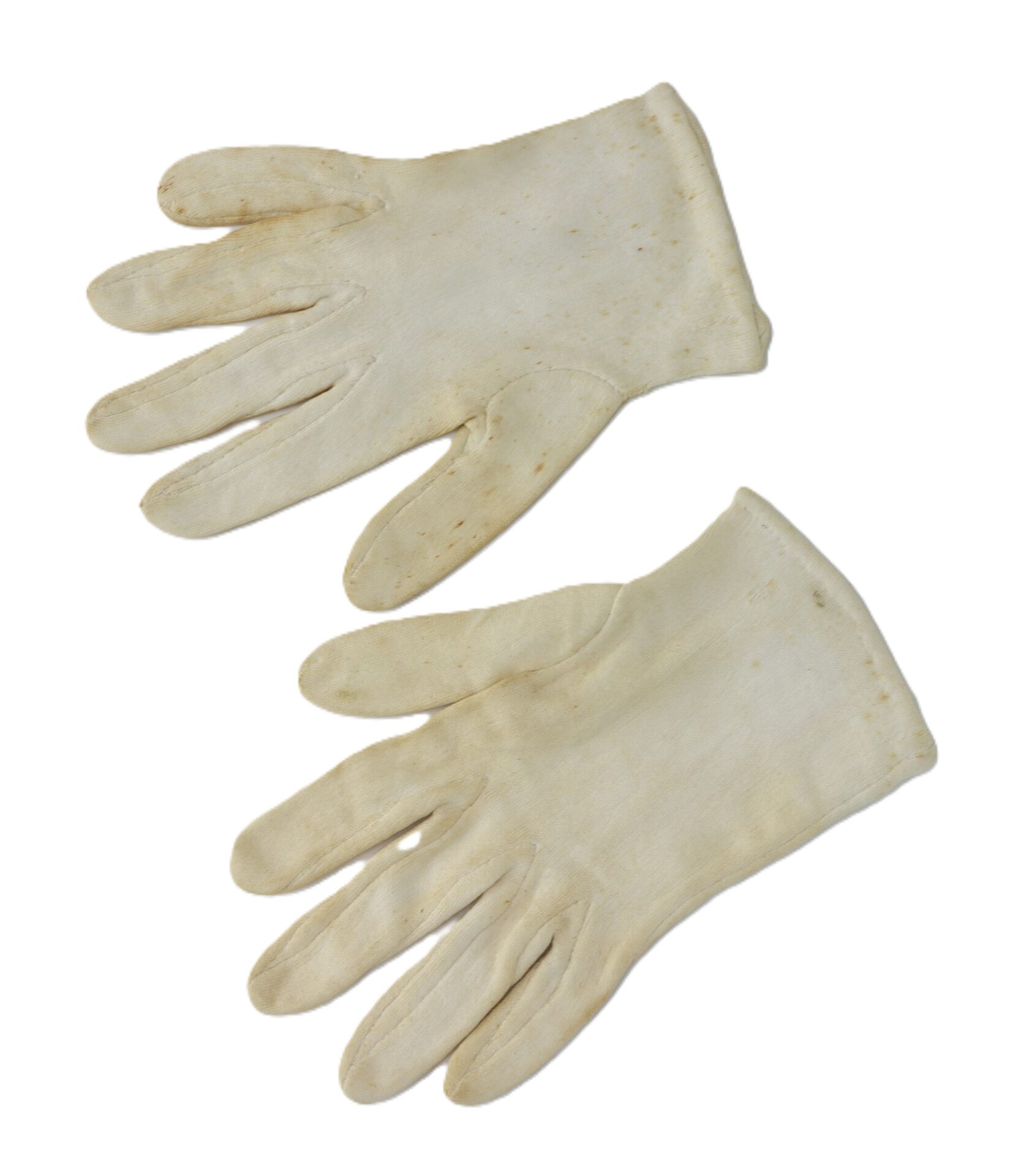 A pair of off-white, slightly worn fabric gloves laid flat on a white background.