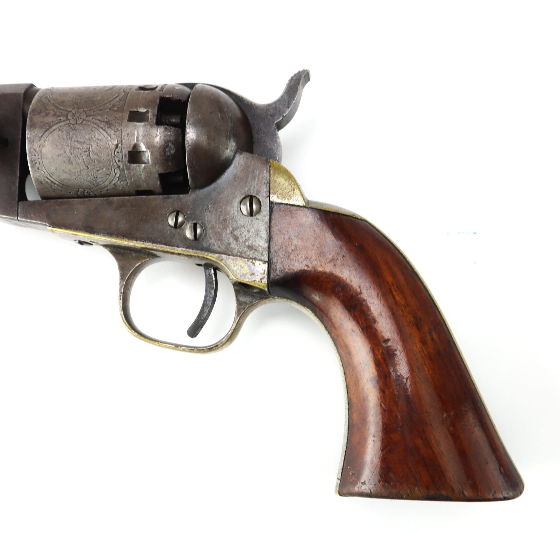 A close-up of a vintage revolver with a worn metal barrel and a polished wooden grip, displayed on a white background.