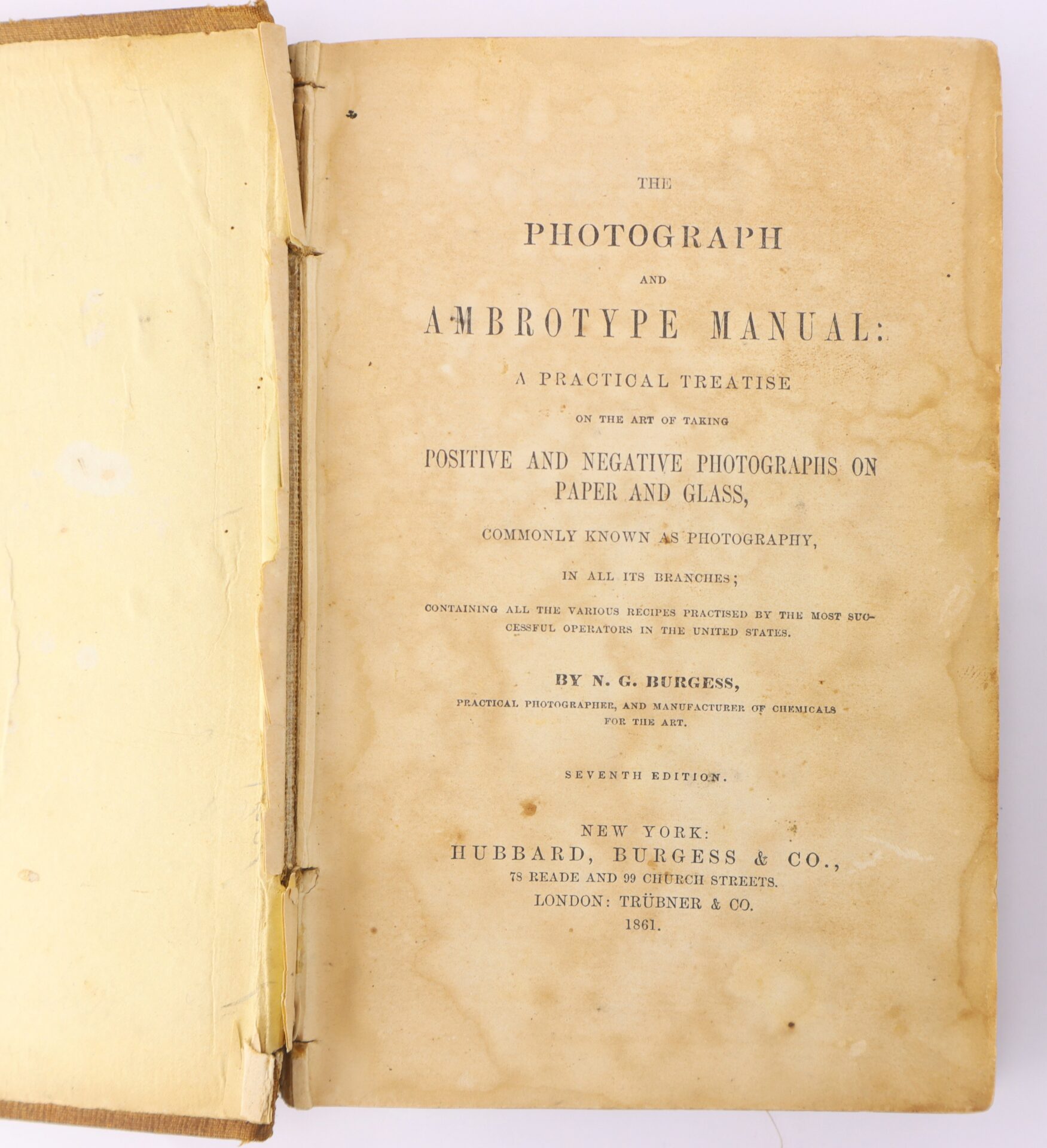 Open book showing the title page of "The Photograph and Ambrotype Manual," a photography guide by N.G. Burgess, published in 1861 by Hubbard, Burgess & Co.