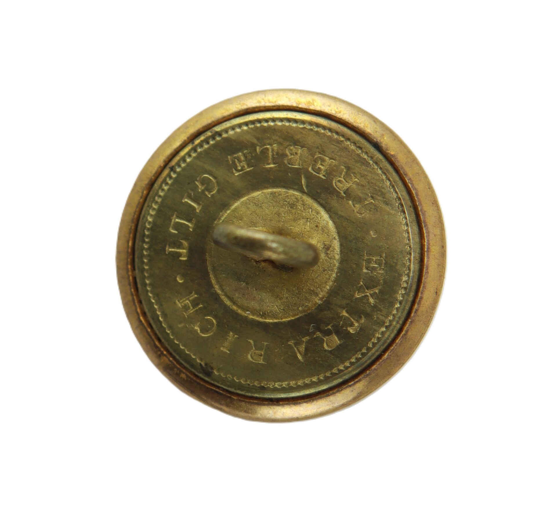 Round brass button with a loop shank, inscribed with the words "EXTRA RICH TREBLE GILT" around the edge.