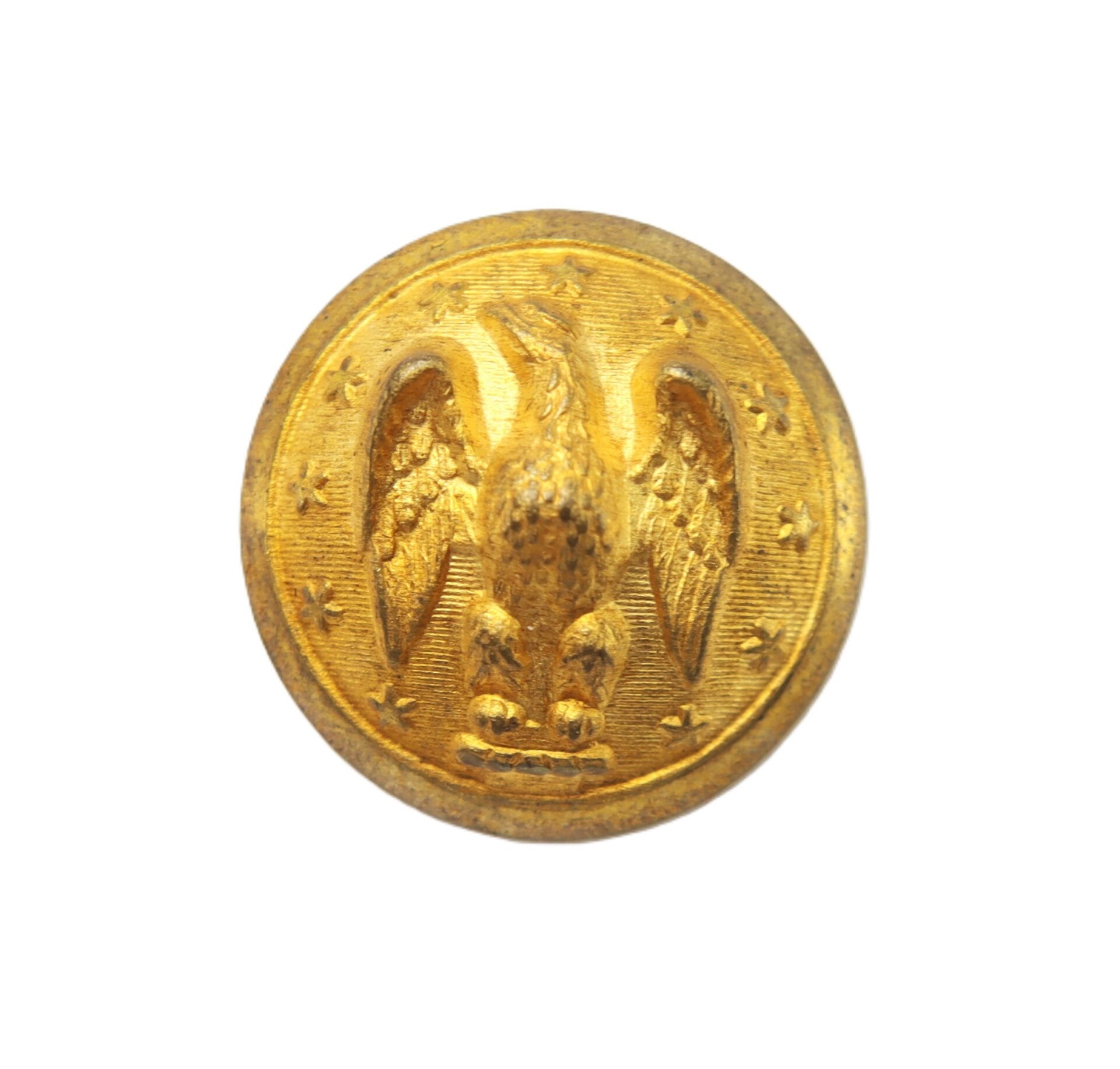 Gold button featuring a raised eagle with spread wings surrounded by stars on a plain background.