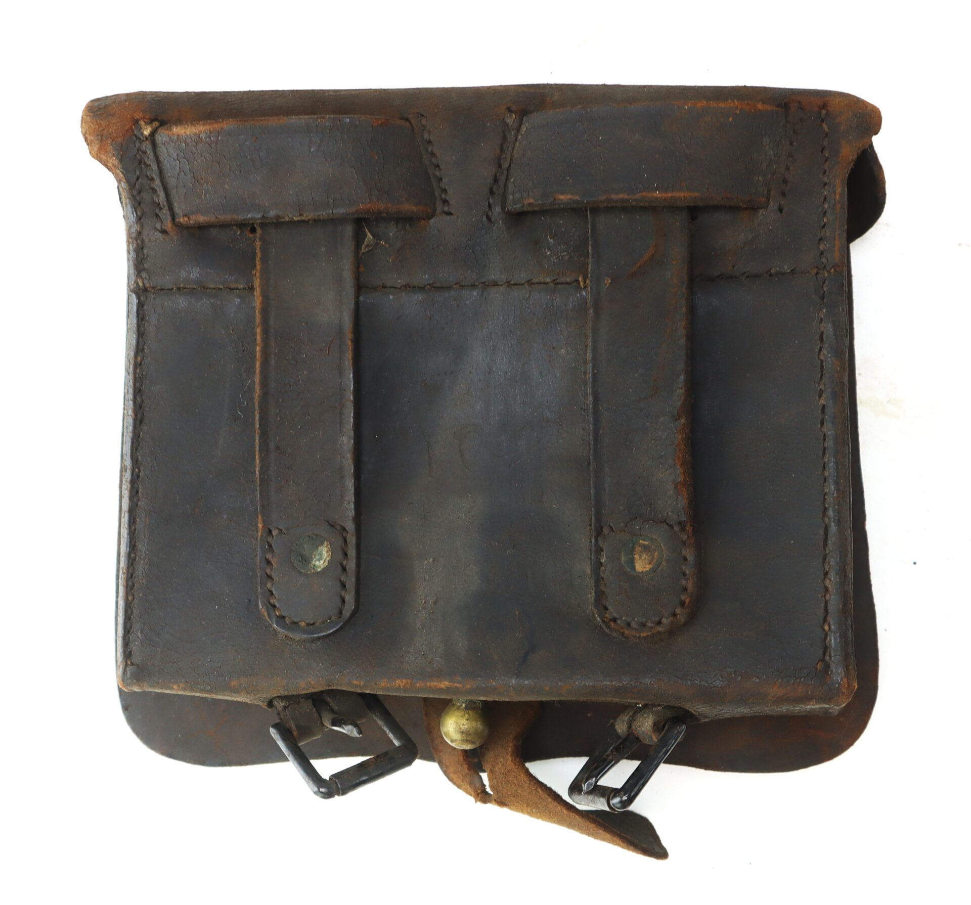 A worn, brown leather satchel with two front straps, metal buckles, and visible stitching, showing signs of age and use.