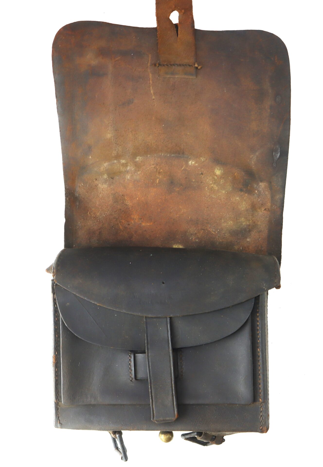 A worn, brown leather satchel with the flap open, showing signs of age and use.