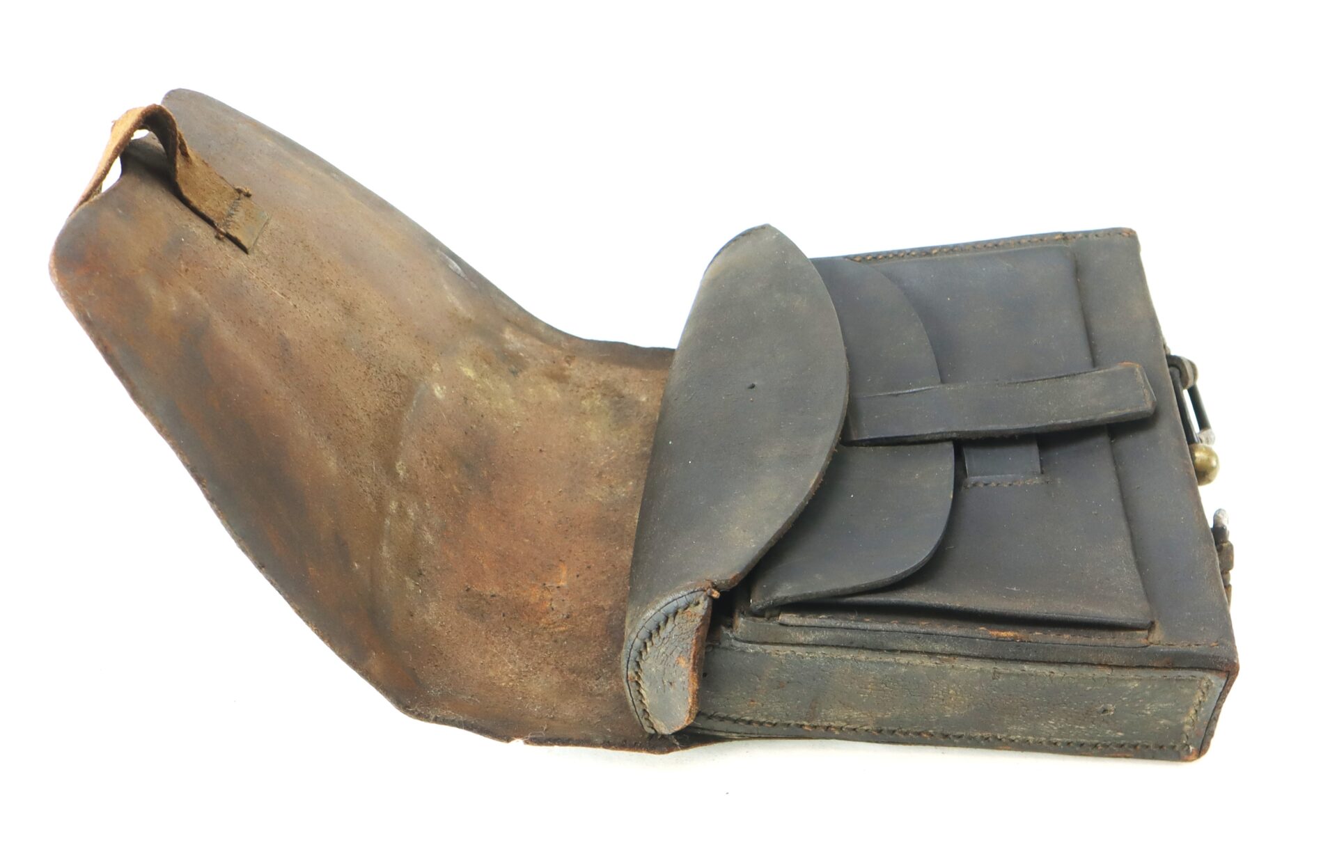 A vintage leather satchel with a flap cover partially open, showing its worn exterior and inner compartment.