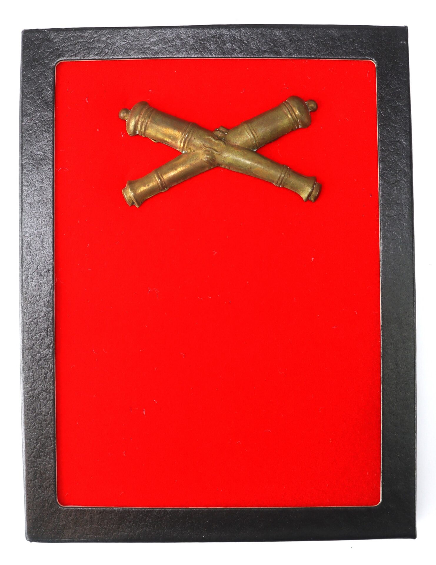 A black frame displays two crossed brass cannons on a bright red background.
