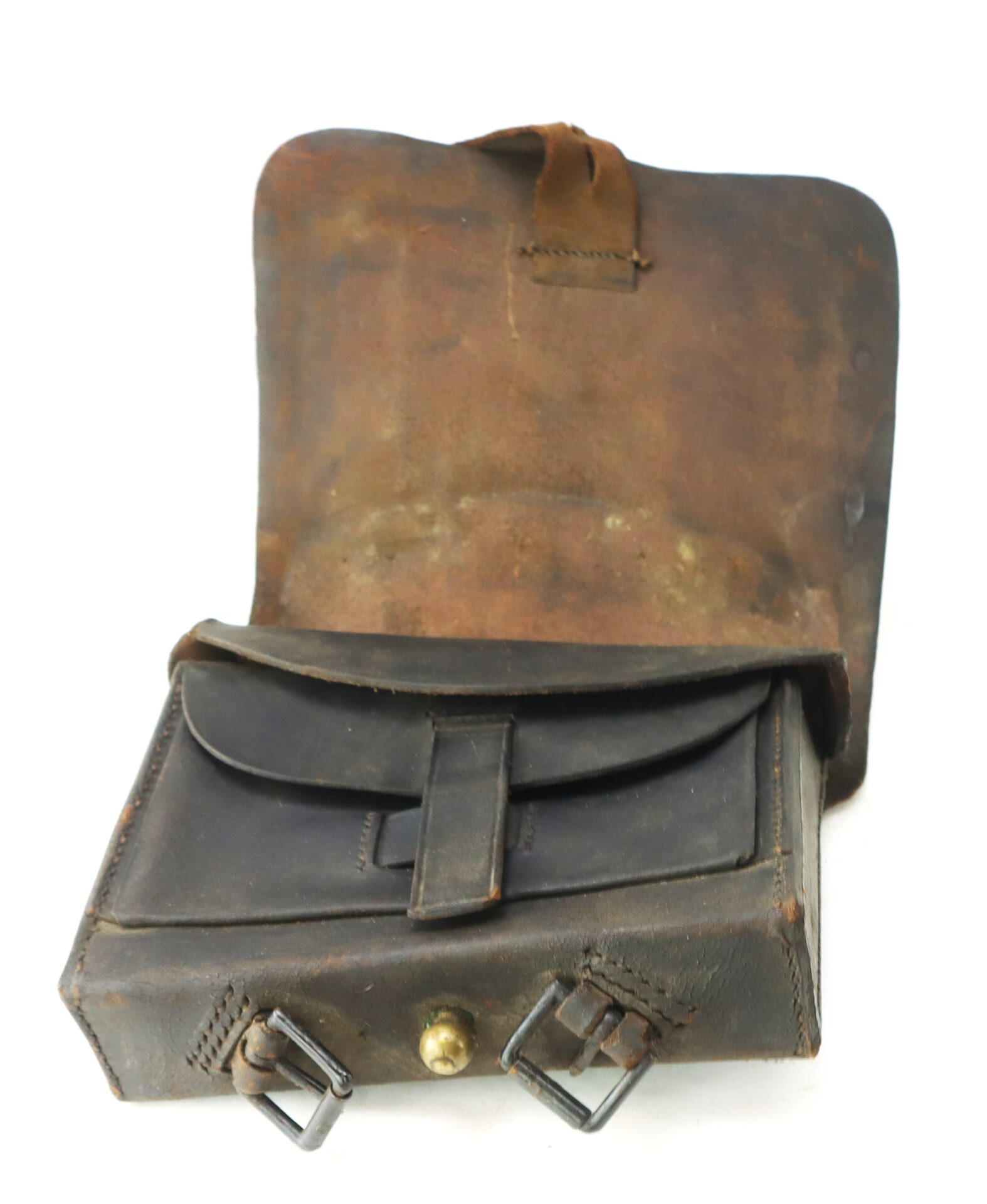 A worn brown leather satchel with the flap open, showing an inner pocket and metal buckles on the front.