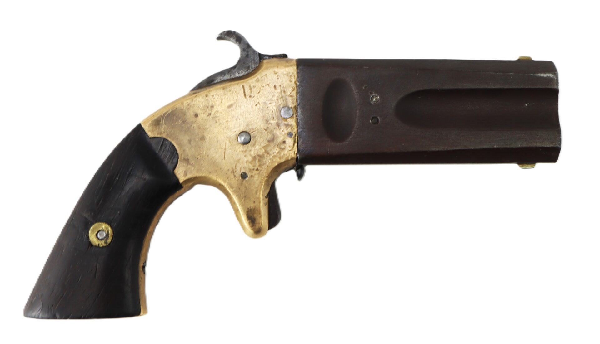 A small antique derringer-style pistol with a brass frame, black grip, and a short dark barrel, displayed on a white background.