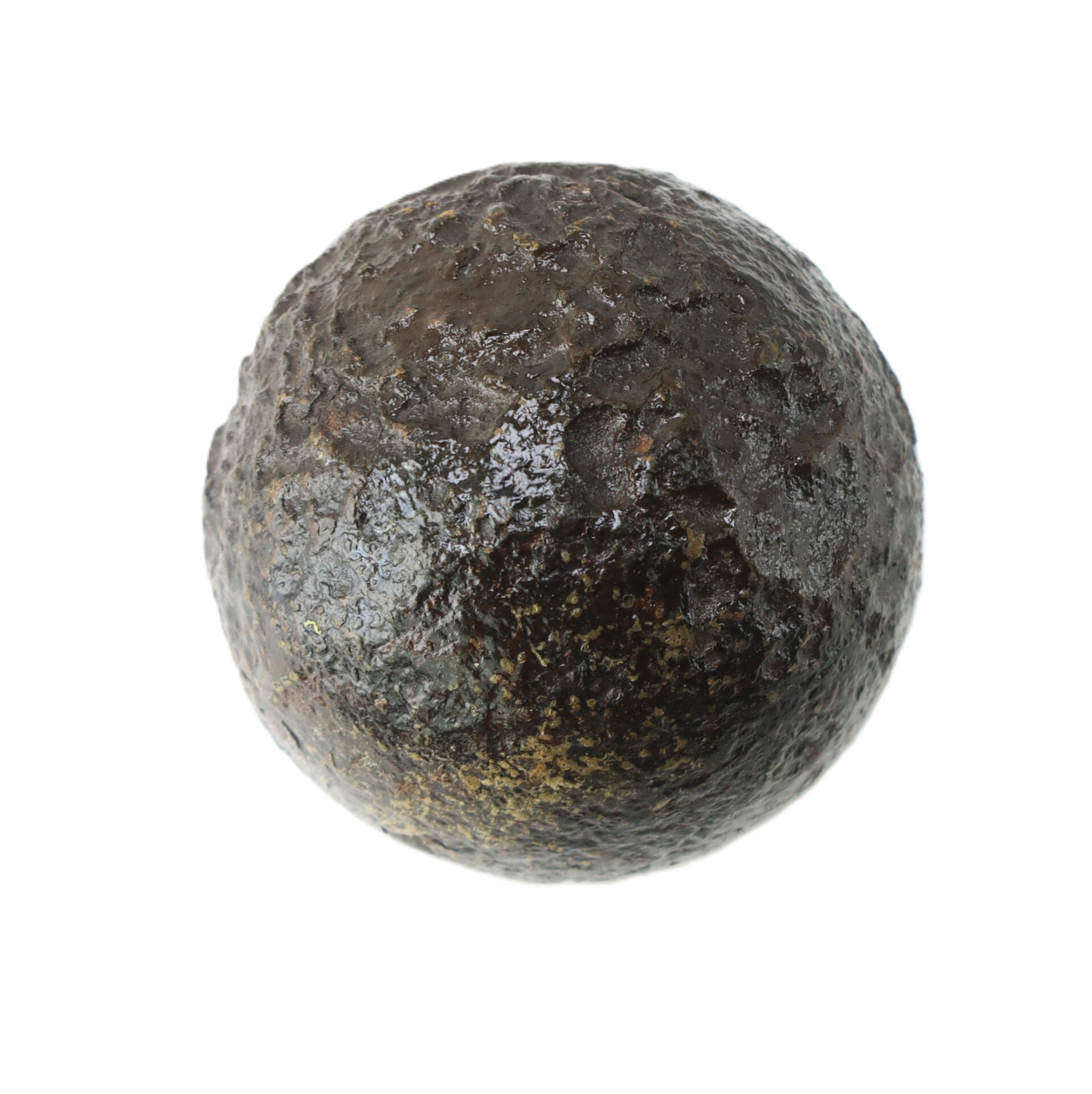 A dark, round, and textured metallic cannonball displayed against a white background.