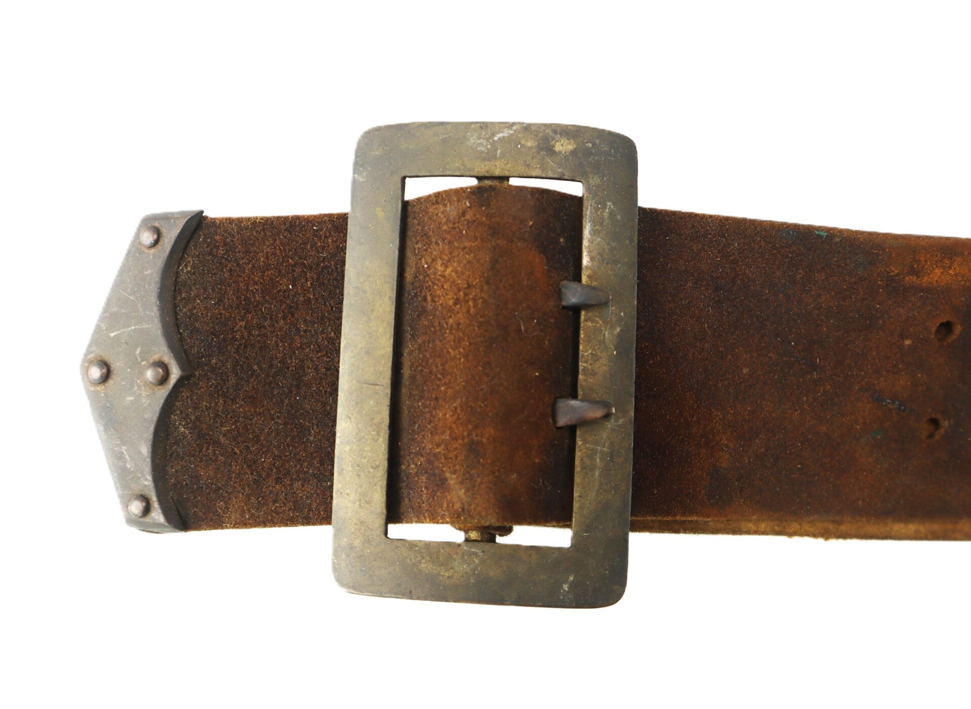 A close-up of a worn brown leather belt with a tarnished metal buckle and decorative metal tip.