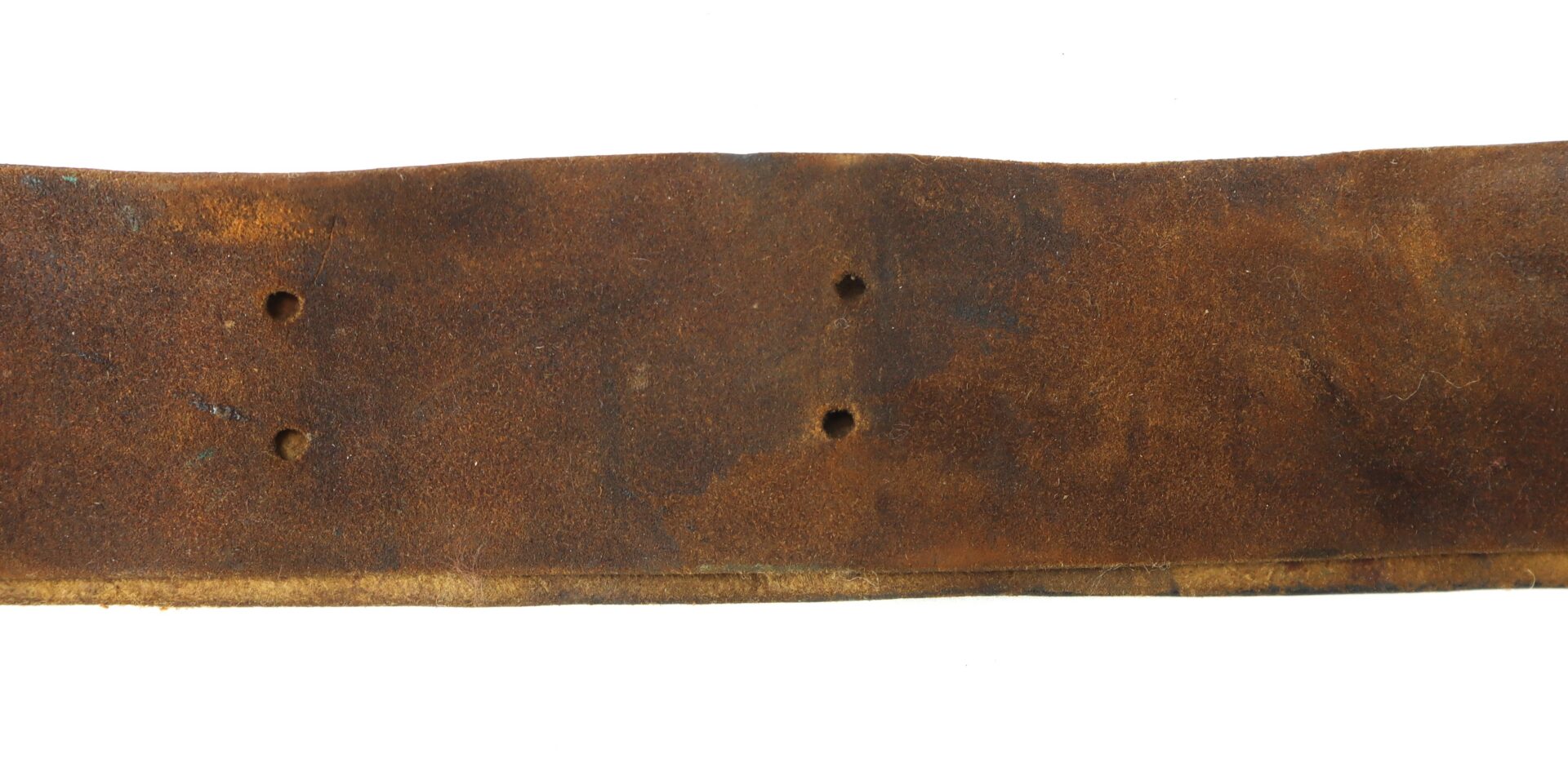 A close-up of a worn brown leather belt with four punched holes, showing signs of aging and use.