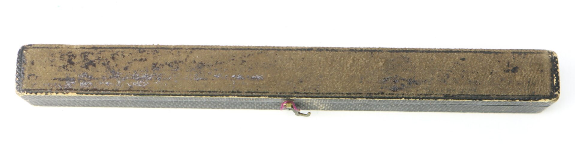 A long, rectangular, worn brown box with a textured surface and a small metal latch at the front.