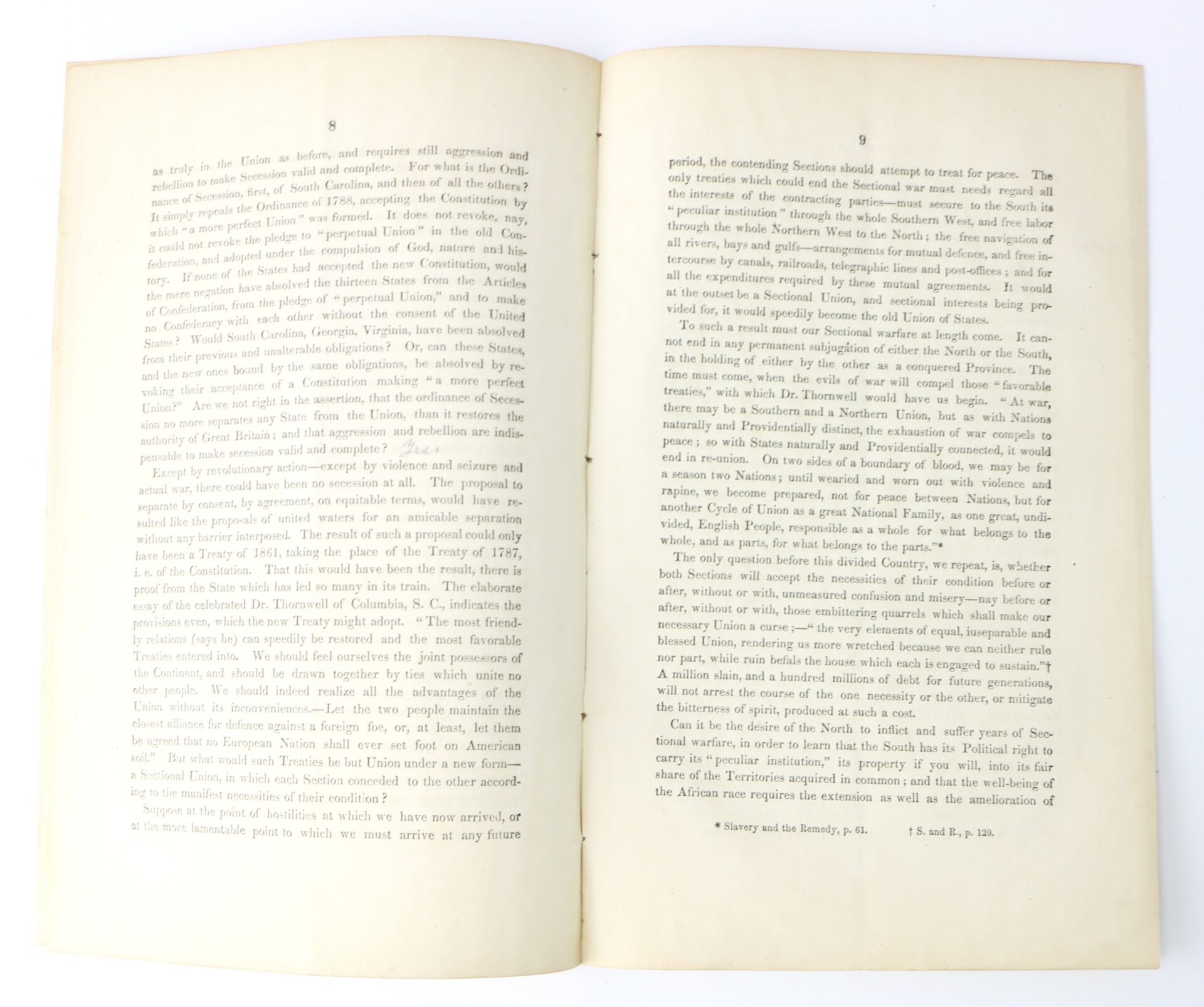 An open book displaying two pages of typed text with evenly spaced lines, lying flat on a white background.
