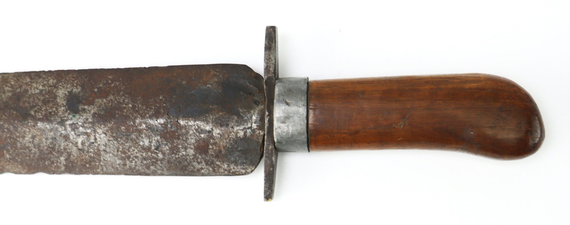 A close-up of a large, rusted knife or machete with a wooden handle and metal guard against a white background.