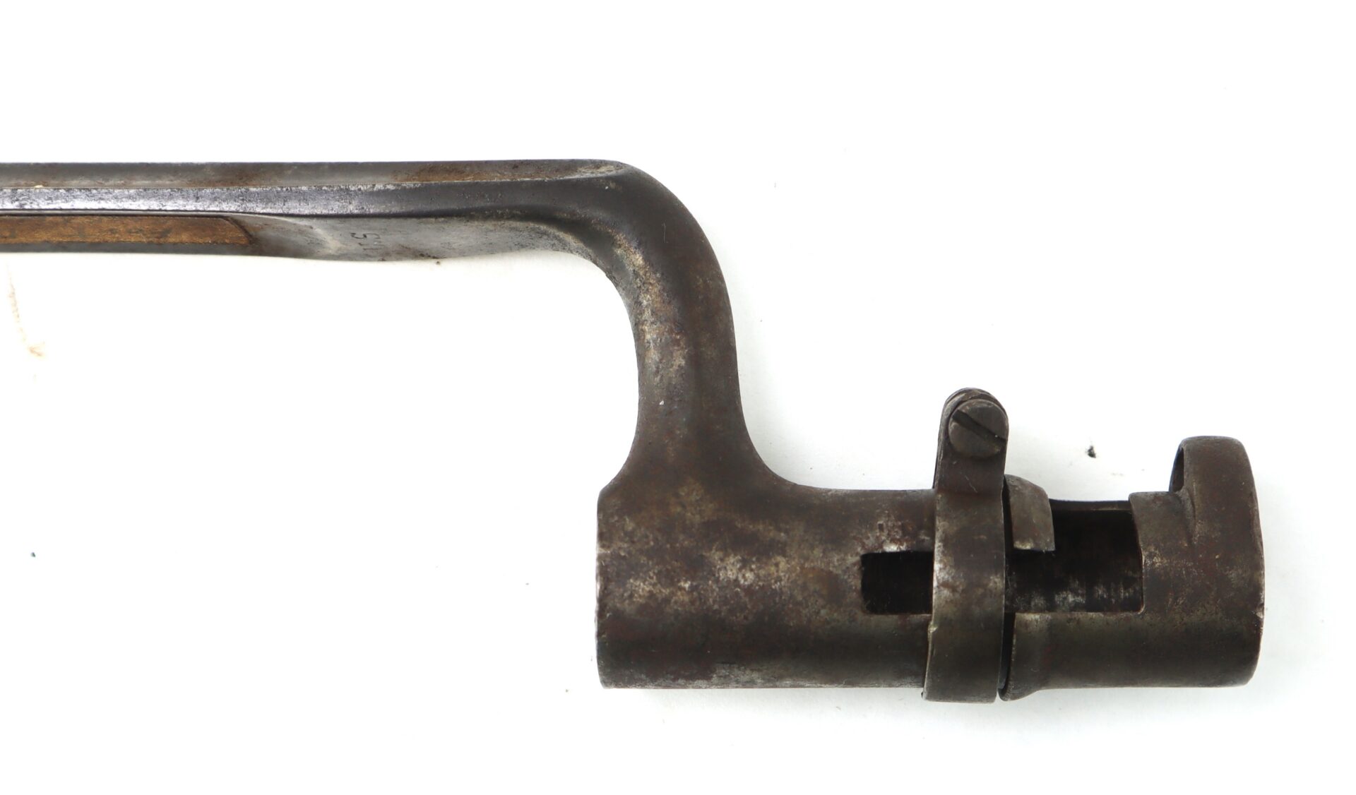 A close-up of an old, metal bayonet with a locking ring mechanism, photographed on a white background.