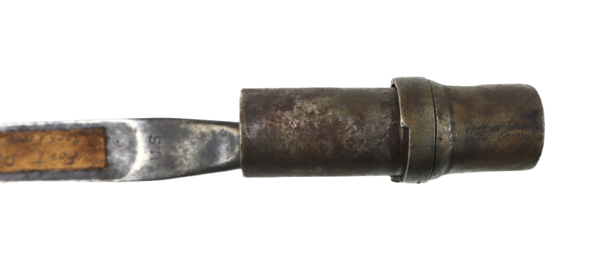 A close-up of a vintage metal chisel with a round, worn ferrule and a partially visible wooden handle.