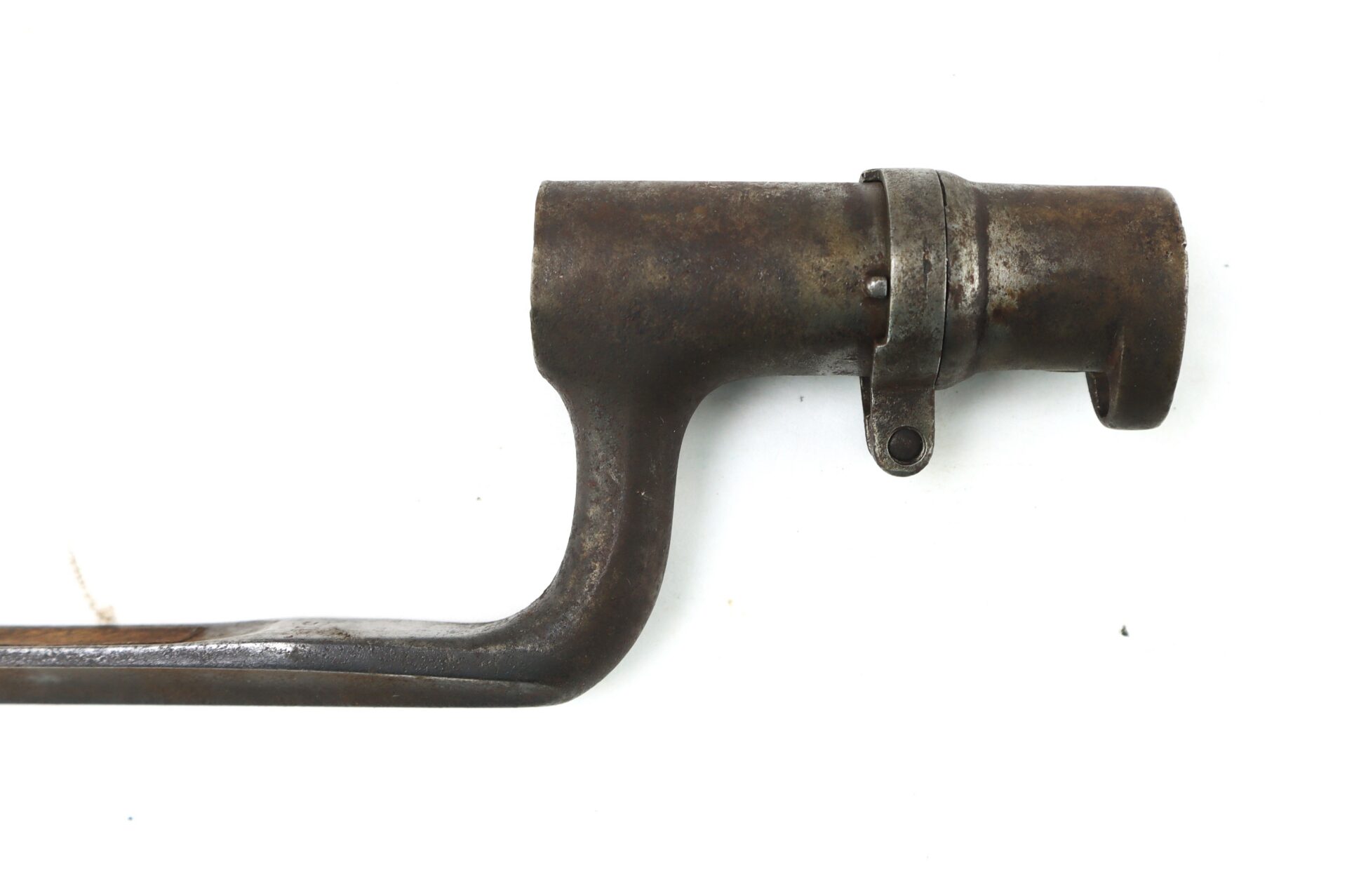 Close-up of a rusted metal socket bayonet with a cylindrical barrel mount and curved blade, isolated on a white background.