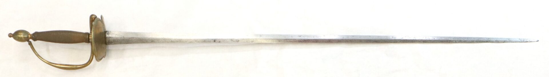 A metal fencing sword with a slender blade, a brass guard, and a textured grip, displayed against a white background.