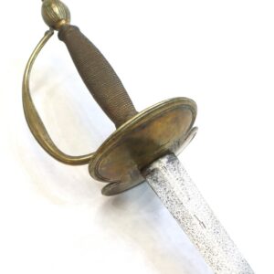 A close-up view of an antique sword with a brass guard, wire-wrapped handle, and a slightly tarnished, straight blade on a white background.