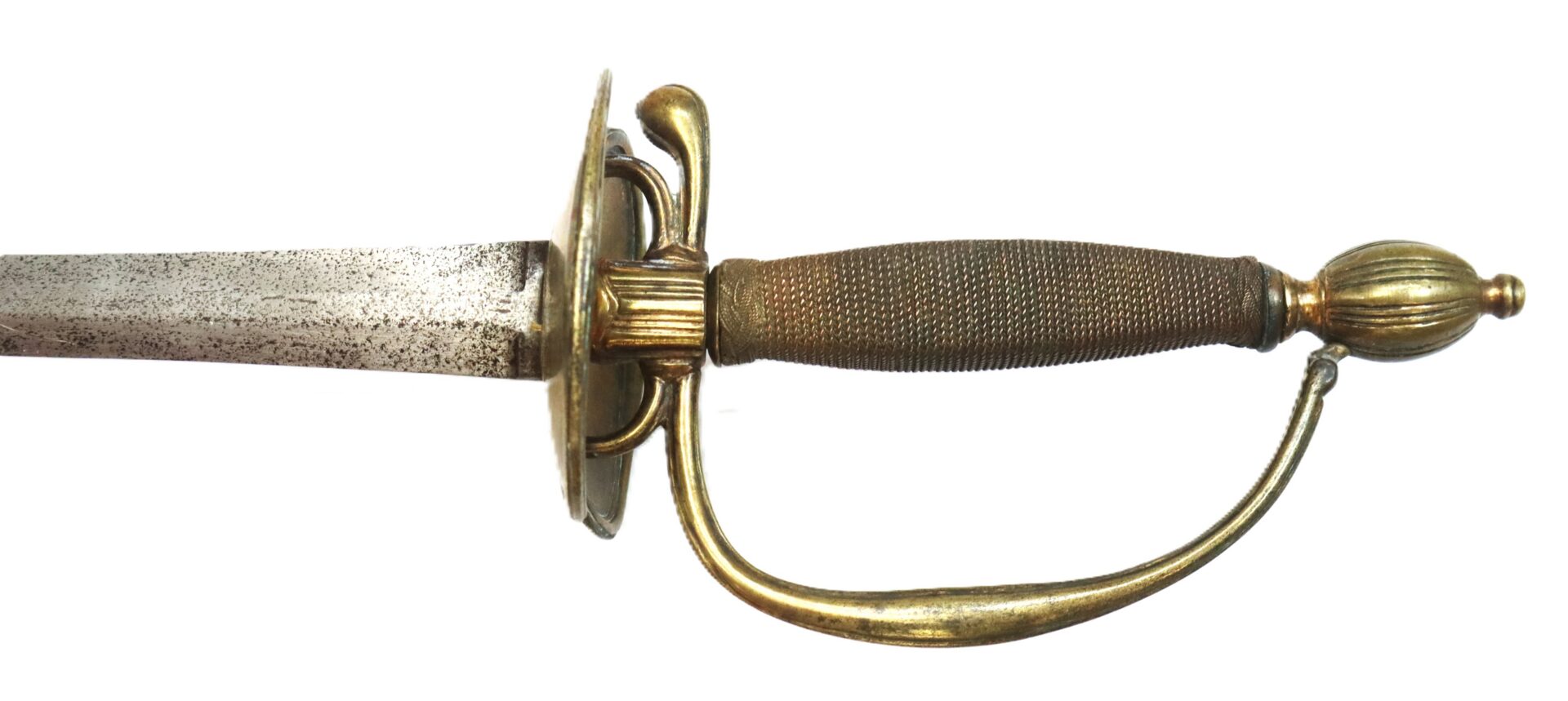 A close-up of the hilt and part of the blade of an antique sword with a textured metal grip and curved brass handguard.