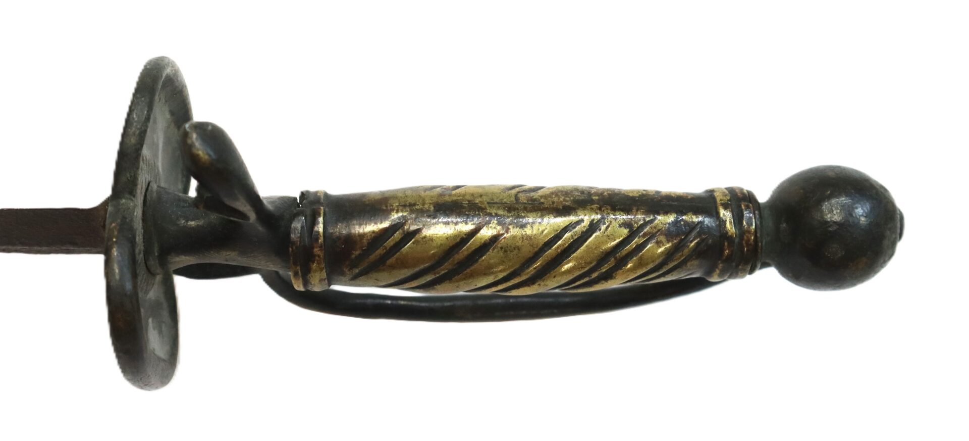 Close-up of an antique sword hilt with a spiral-patterned brass grip, rounded pommel, and a protective metal guard, isolated on a white background.