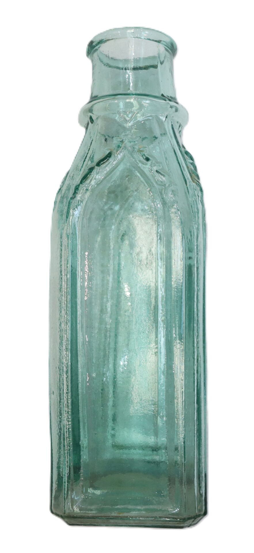 A clear, vintage glass bottle with a square base, vertical ridges, and a short neck, viewed against a white background.