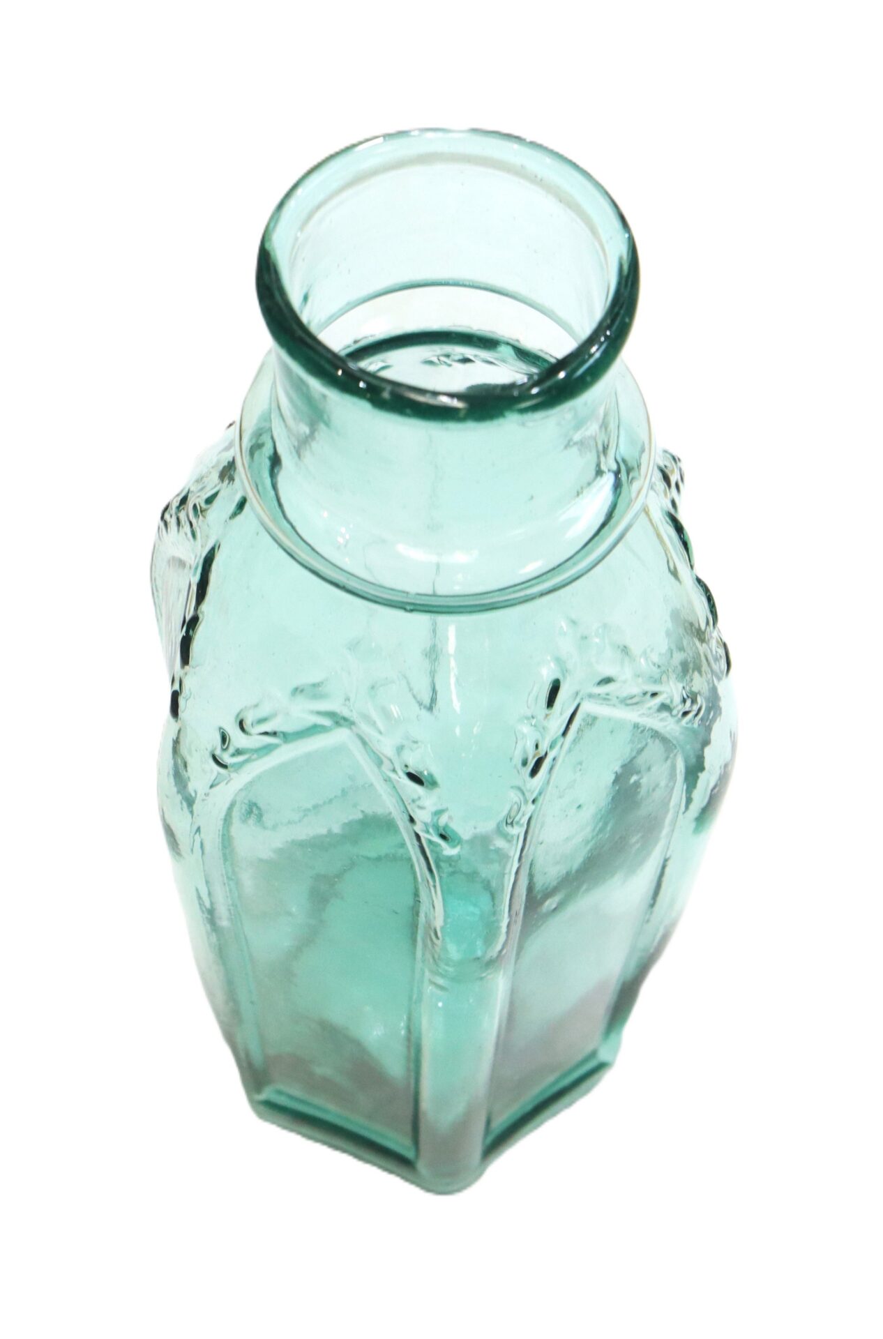 Clear hexagonal glass vase with a wide neck and embossed vertical lines, photographed against a white background.