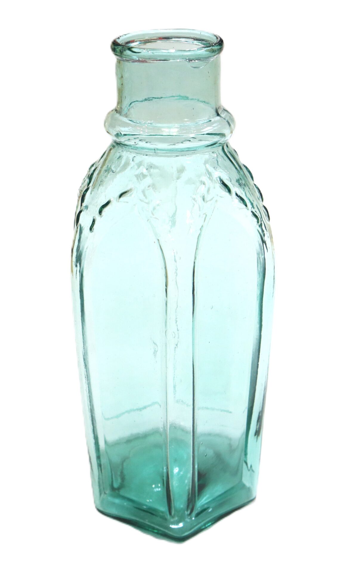 Clear, light blue hexagonal glass bottle with a wide neck and decorative ridges near the top, standing upright on a white background.