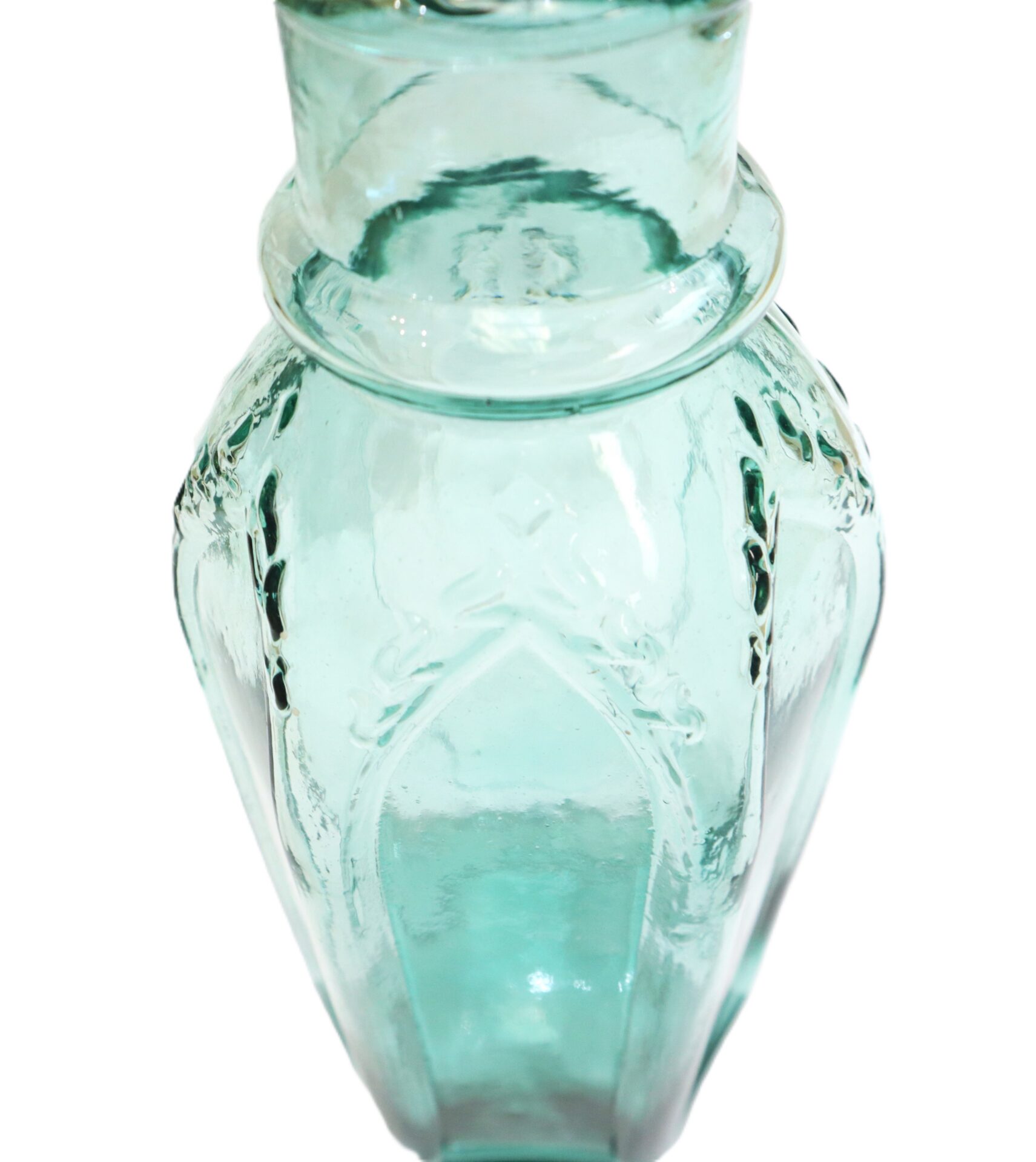 Clear, light blue glass vase with embossed decorative patterns and a wide, rounded neck, photographed against a white background.