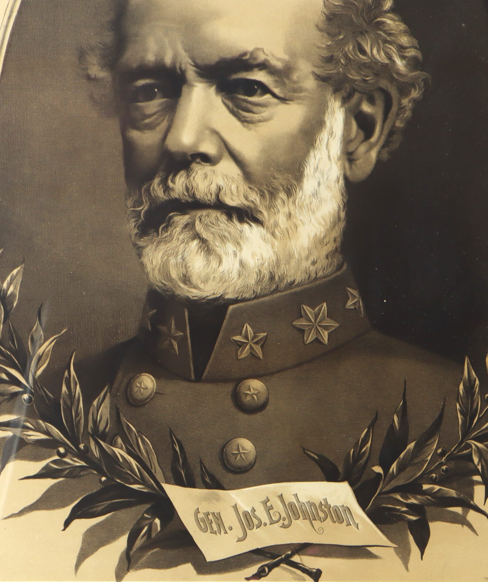 Sepia-toned portrait of a bearded man in a military uniform with three stars on the collar, with a label reading "Gen. Jos. E. Johnston" and decorative leaves below.