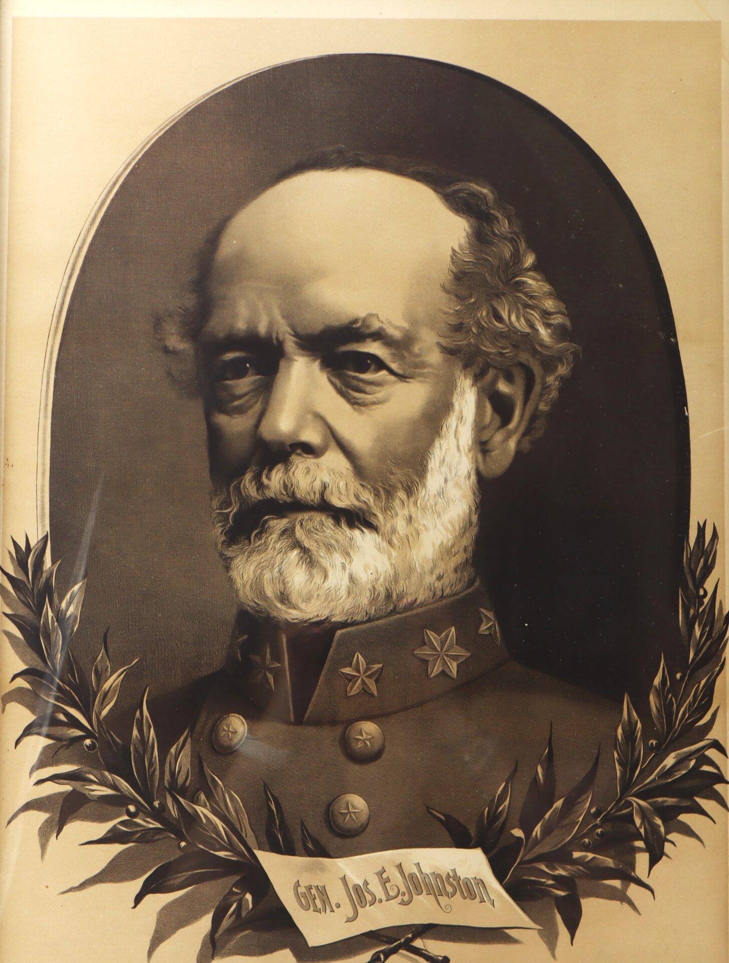 A sepia-toned portrait of a man in a military uniform with stars on the collar, surrounded by laurel leaves, labeled "Gen. Jos. E. Johnston.