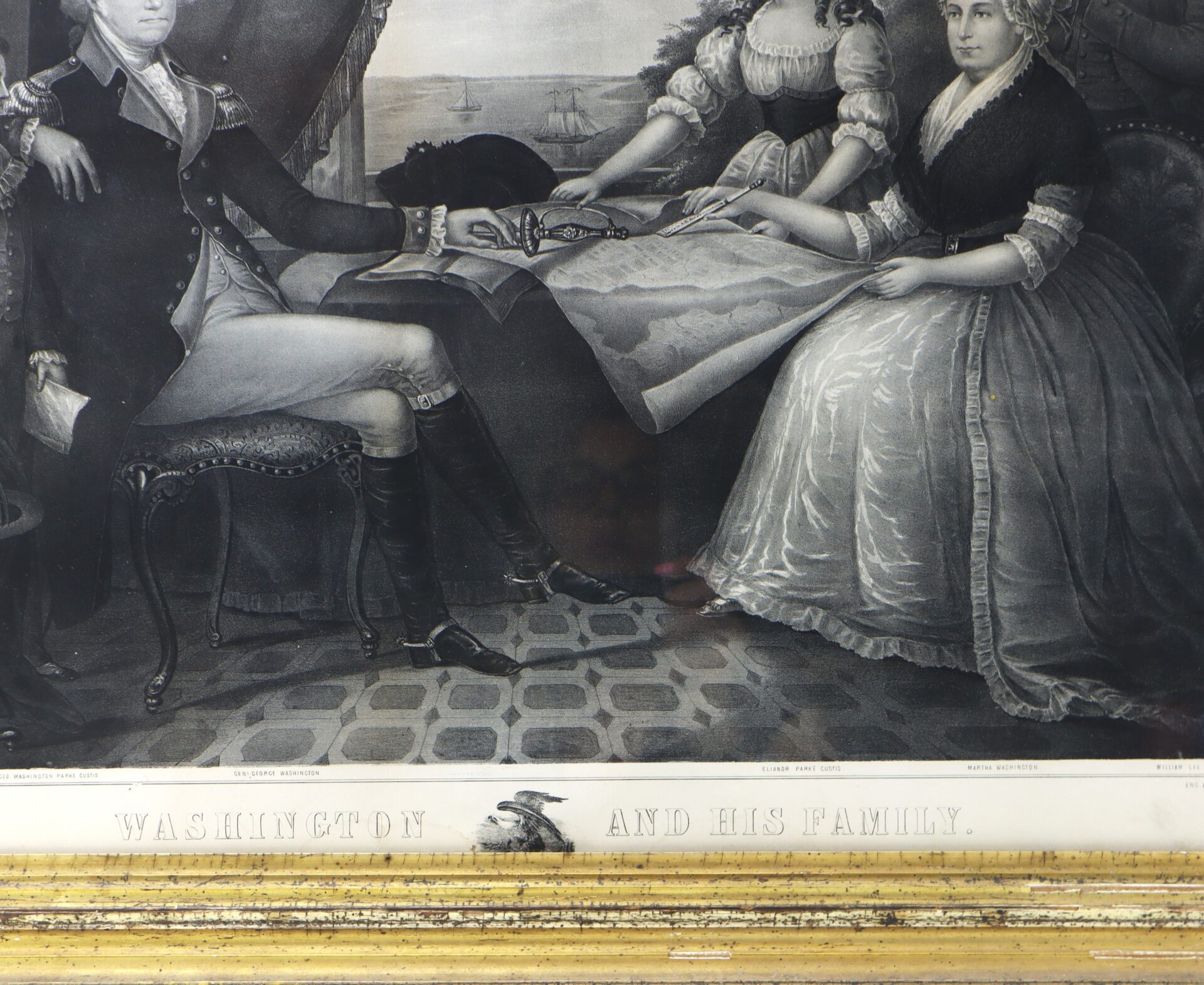 Black-and-white illustration of George Washington seated with his family around a table, looking at a map. The text below reads, "Washington and His Family.