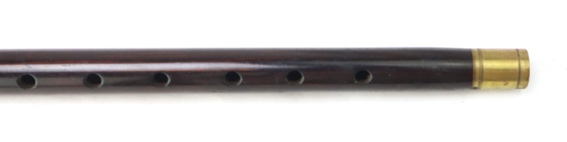 A Civil War–Era Fife with Brass Fittings, Gettysburg Provenance, featuring six holes and a metal band near one end, is shown in close-up against a white background.