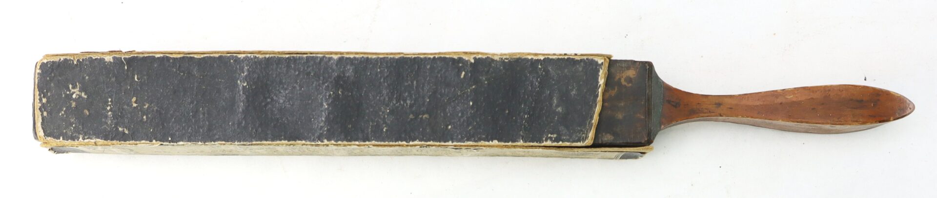 The J.R. Torrey’s Patent Razor Strop, dated 1861, is a vintage leather strop with a wooden handle for sharpening straight razors, shown on a plain white background.