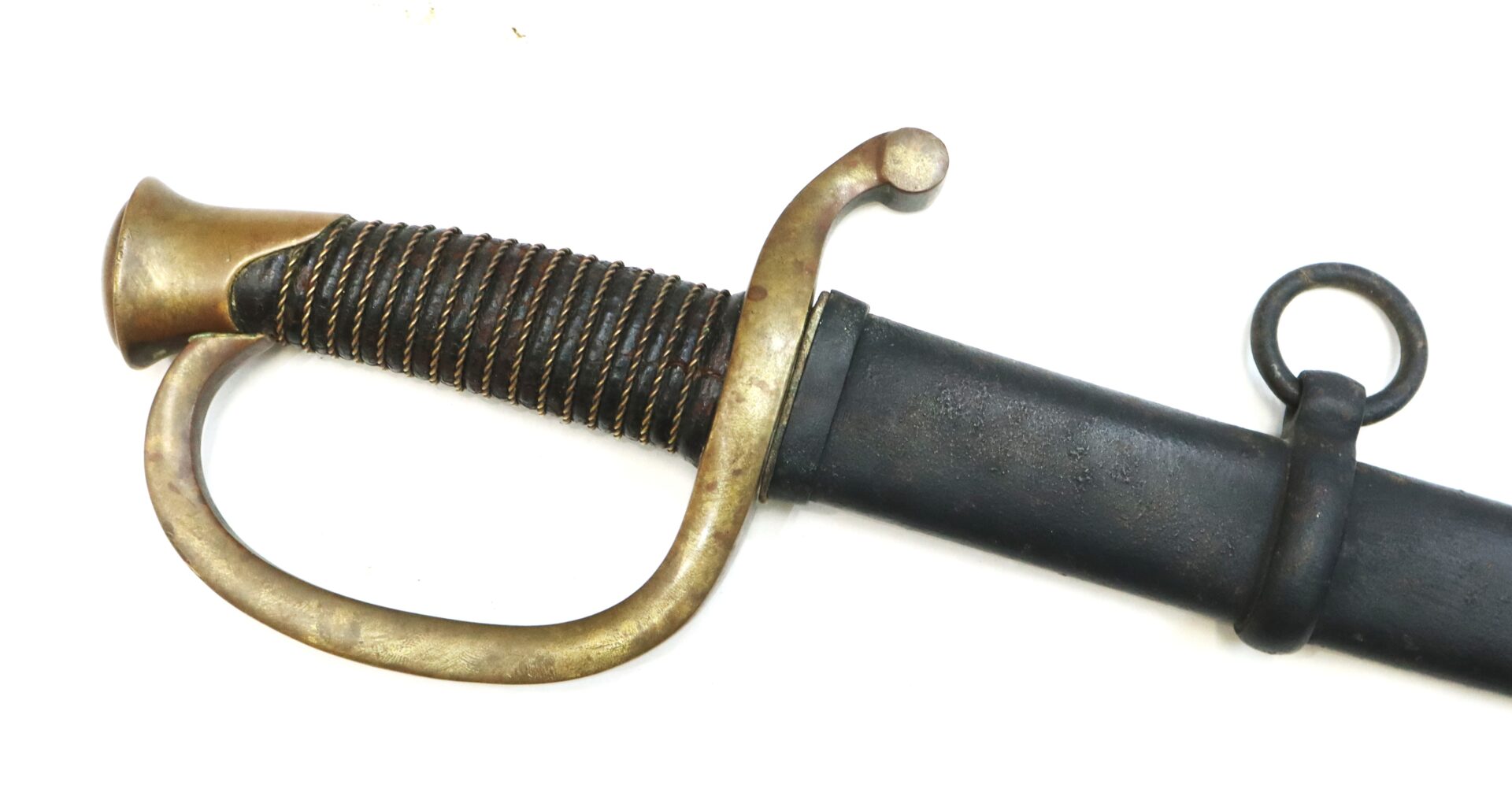 A close-up view of an antique sword hilt with a brass guard and wrapped handle, partially sheathed in a black scabbard with a metal ring.