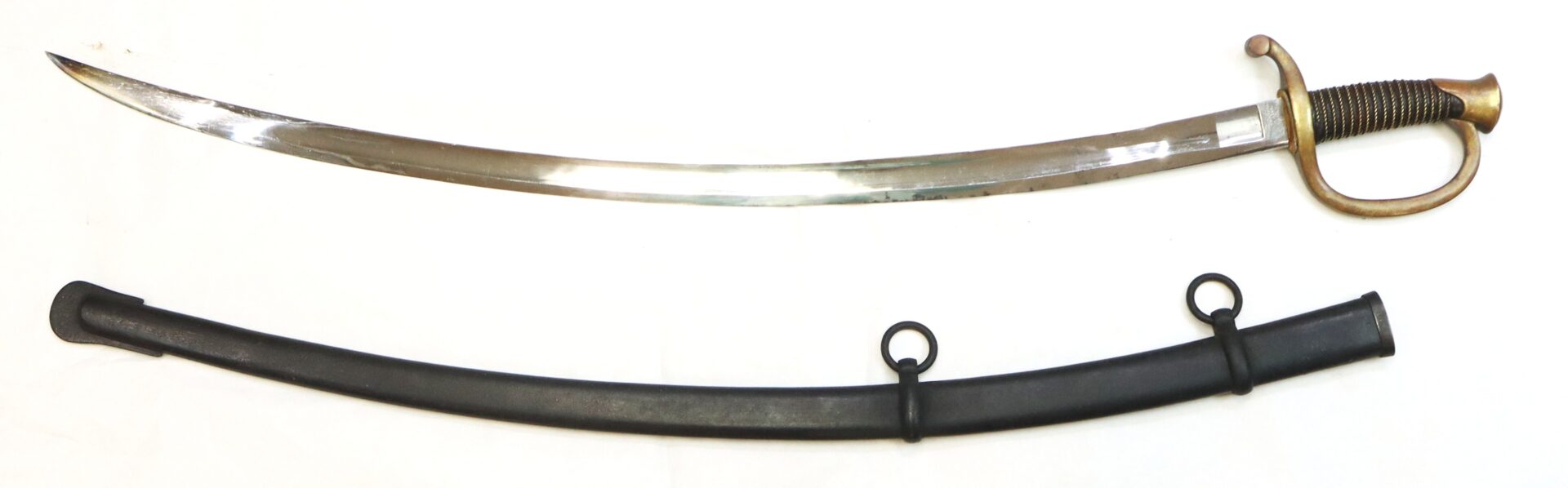 A curved sword with a brass hilt and knuckle guard is shown above a black scabbard with two metal loops for attachment.