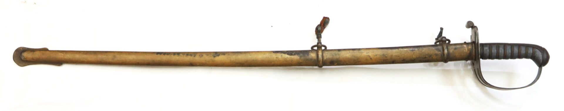 A vintage sword with a black ribbed handle, metal guard, and a worn brass scabbard, displayed on a plain white background.