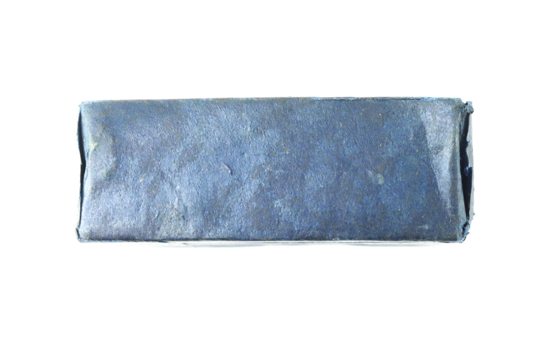 A rectangular bar wrapped in plain blue paper, photographed against a white background.