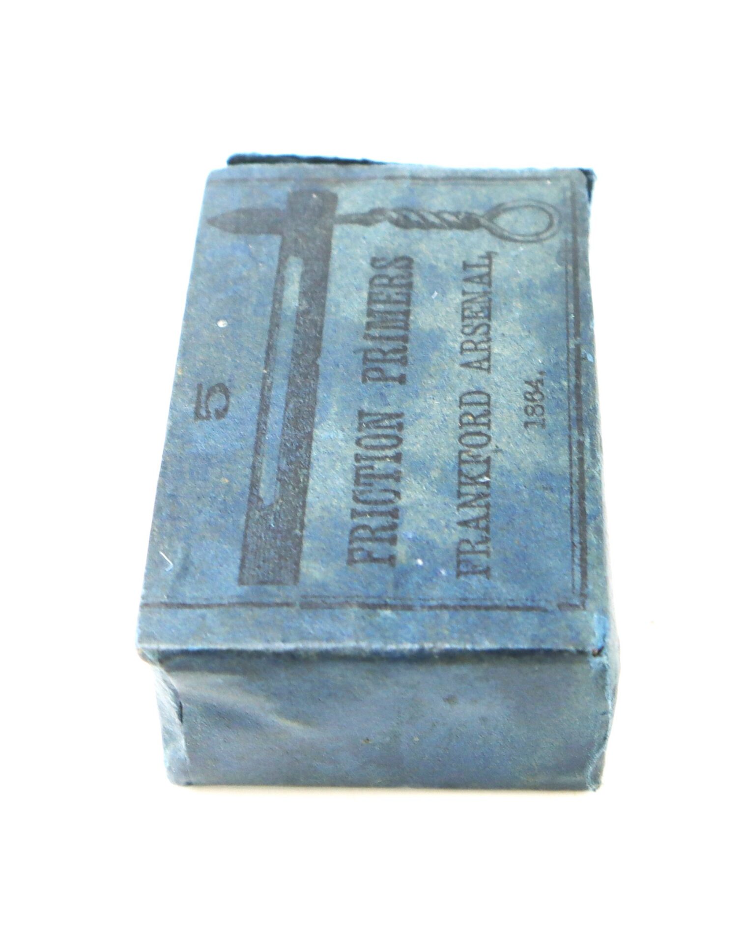 A small blue paper box labeled "Friction Primers, Frankford Arsenal, 1864" with an illustration of a tool on the top.