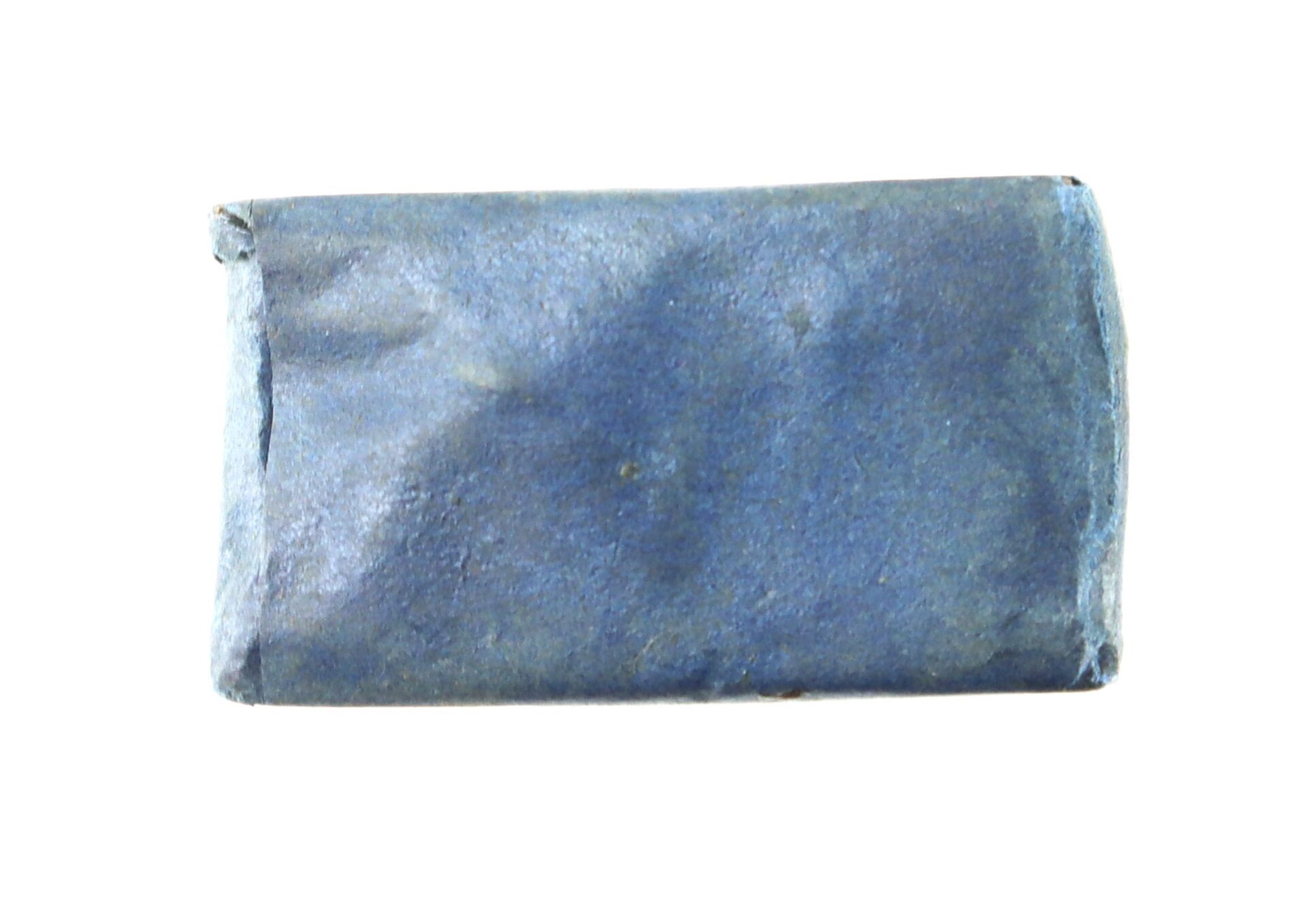 A small rectangular object wrapped in blue paper, viewed against a plain white background.