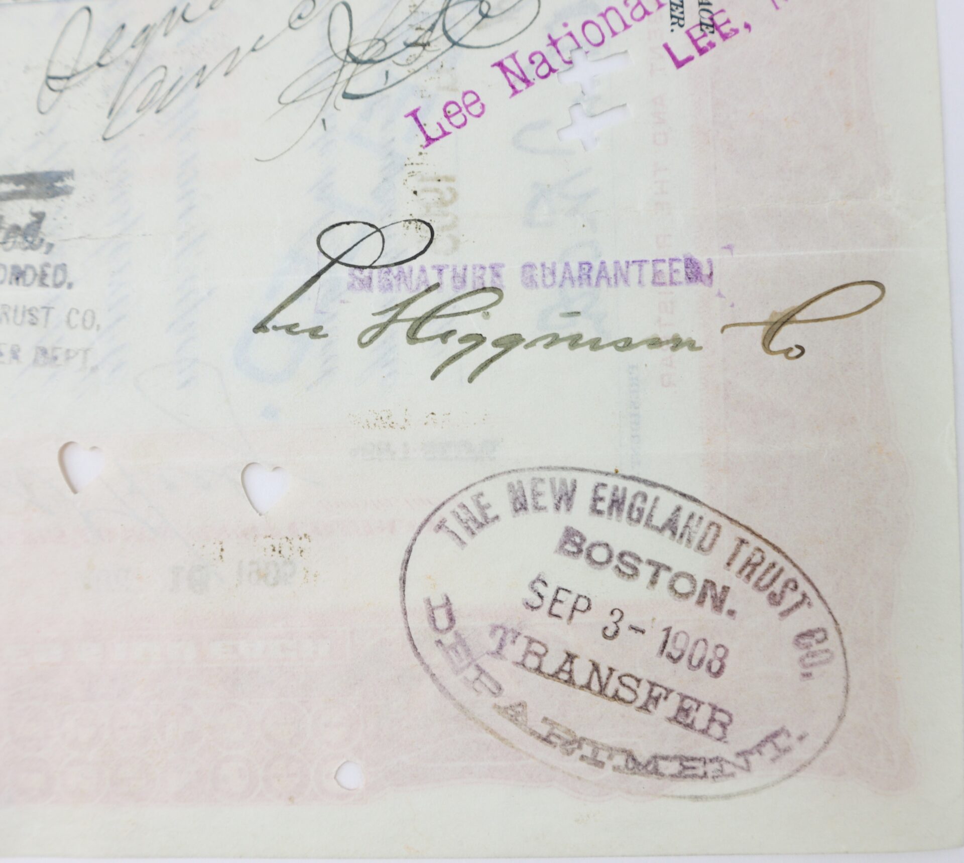 Close-up of a document showing handwritten signatures, a purple "SIGNATURES GUARANTEED" stamp, and a round "NEW ENGLAND TRUST CO. BOSTON TRANSFER DEPARTMENT" stamp dated Sep 3, 1908.